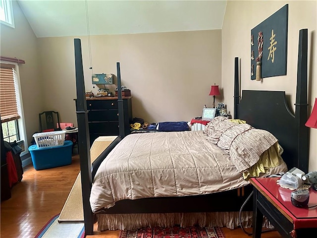 226 Hawk Hill Ln, Lakemont, GA 30552 - bedroom featuring lofted ceiling, wood finished floors, and multiple windows
