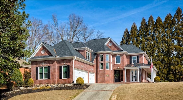 view of front of home with brick siding, concrete driveway, an attached garage, a balcony, and a front lawn