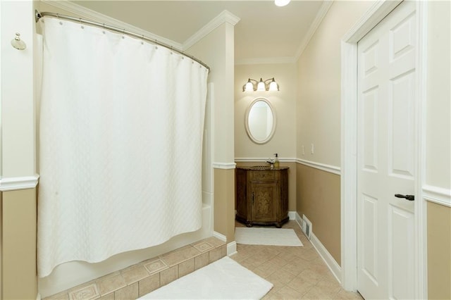 full bathroom featuring shower / tub combo, baseboards, visible vents, tile patterned flooring, and crown molding