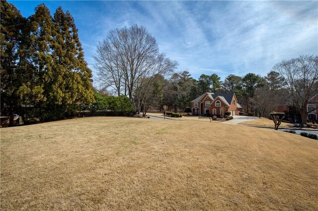 rear view of house with a chimney, an outdoor fire pit, a patio area, a wooden deck, and stairs