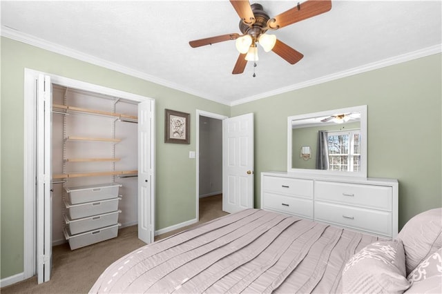 bedroom featuring crown molding, carpet floors, a closet, and baseboards