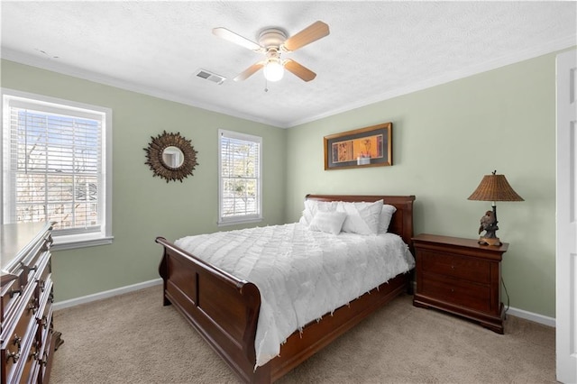 bedroom with crown molding, visible vents, light carpet, a textured ceiling, and baseboards