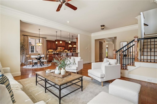 1211 Thornwell Dr, Brookhaven, GA 30319 - living room featuring a ceiling fan, stairway, light wood-style flooring, crown molding, and baseboards