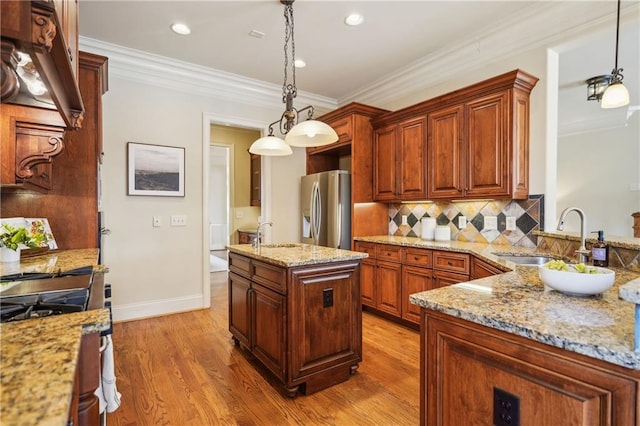 1211 Thornwell Dr, Brookhaven, GA 30319 - kitchen featuring stainless steel appliances, a sink, light wood-type flooring, light stone counters, and ornamental molding