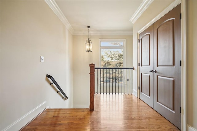 1211 Thornwell Dr, Brookhaven, GA 30319 - hall featuring an upstairs landing, ornamental molding, light wood-type flooring, a chandelier, and baseboards