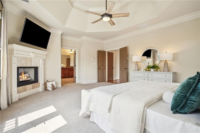 1211 Thornwell Dr, Brookhaven, GA 30319 - bedroom featuring a raised ceiling, ornamental molding, light carpet, a tiled fireplace, and ensuite bath