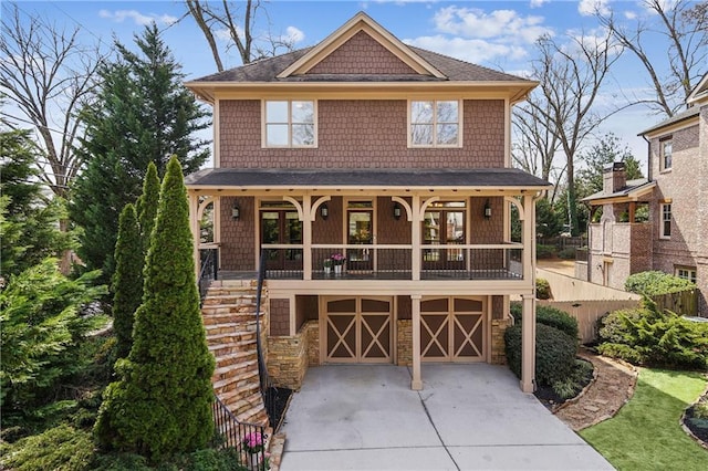 1211 Thornwell Dr, Brookhaven, GA 30319 - view of front of home featuring driveway, a garage, stairs, a shingled roof, and stone siding