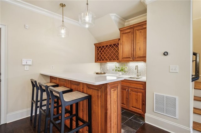 1211 Thornwell Dr, Brookhaven, GA 30319 - indoor wet bar with crown molding, tasteful backsplash, baseboards, and hanging light fixtures