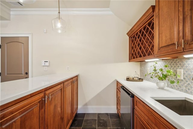 1211 Thornwell Dr, Brookhaven, GA 30319 - kitchen with crown molding, tasteful backsplash, dishwasher, light countertops, and brown cabinets