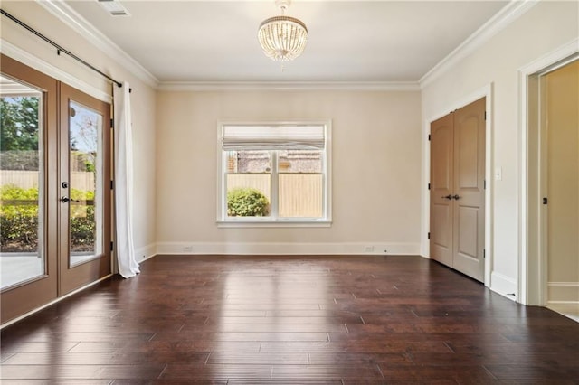 1211 Thornwell Dr, Brookhaven, GA 30319 - spare room with a chandelier, crown molding, dark wood finished floors, and baseboards