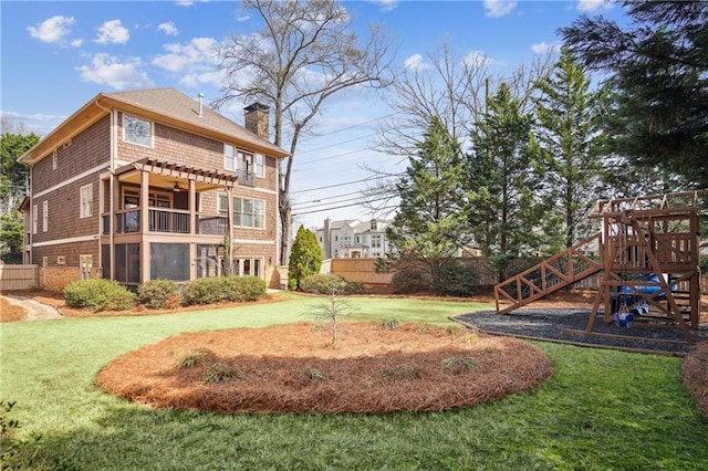1211 Thornwell Dr, Brookhaven, GA 30319 - rear view of property featuring a chimney, a playground, and a balcony