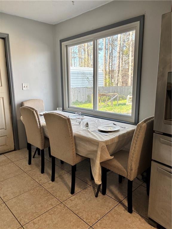dining area featuring light tile patterned floors