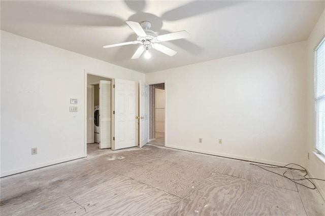 empty room featuring washer / dryer, a healthy amount of sunlight, and ceiling fan