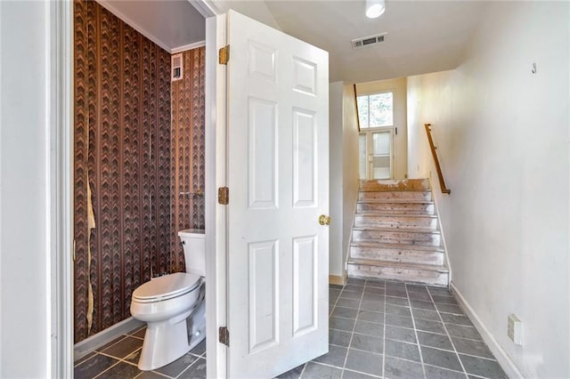 interior space with tile patterned flooring and toilet