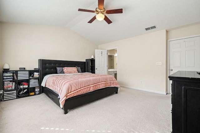 carpeted bedroom with ceiling fan, connected bathroom, and vaulted ceiling