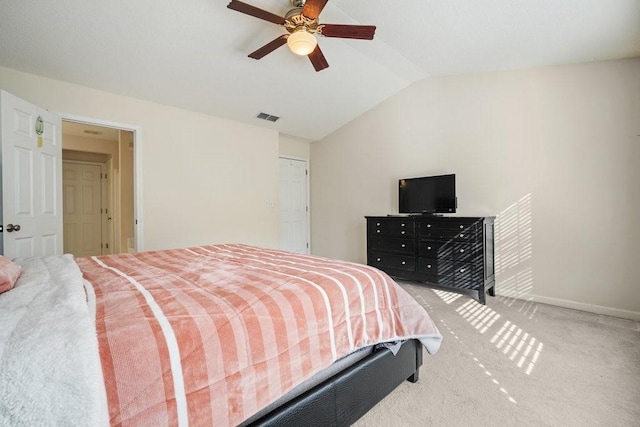 carpeted bedroom featuring vaulted ceiling and ceiling fan