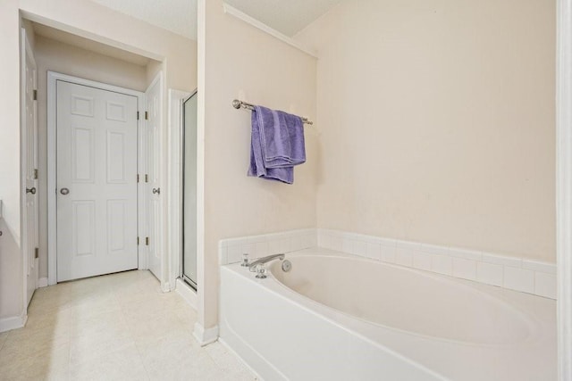 bathroom featuring independent shower and bath