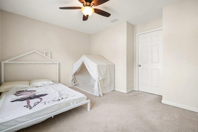 carpeted bedroom with ceiling fan