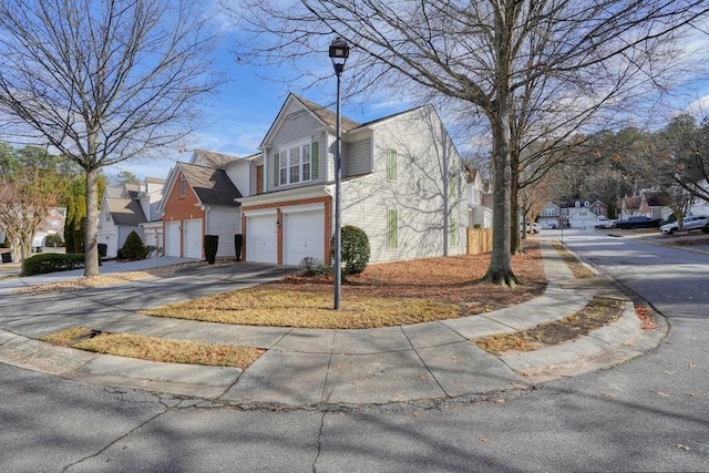 view of side of property with a garage