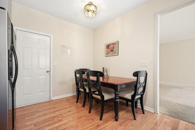 dining space featuring light wood-type flooring