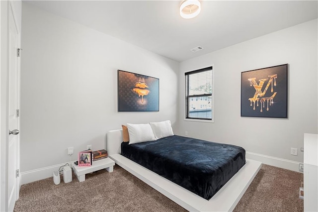 carpeted bedroom featuring baseboards