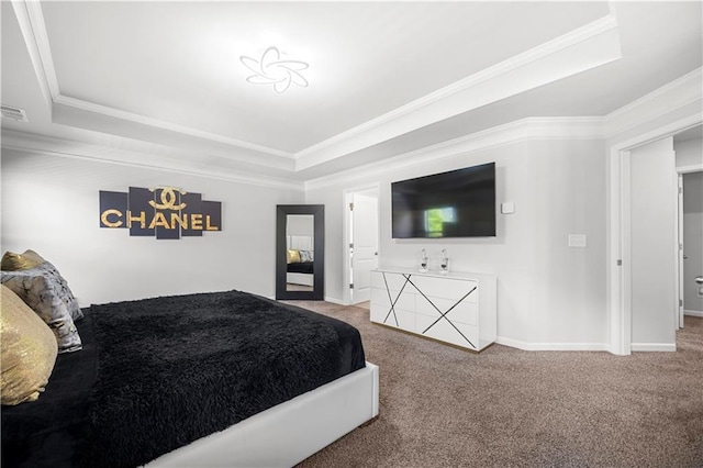 carpeted bedroom with a raised ceiling, crown molding, and baseboards