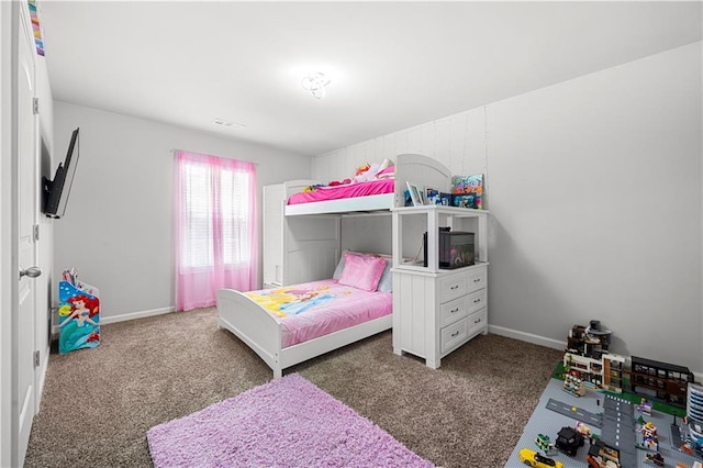 bedroom featuring carpet flooring and baseboards