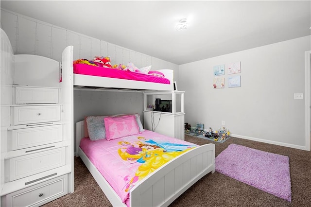 carpeted bedroom featuring baseboards