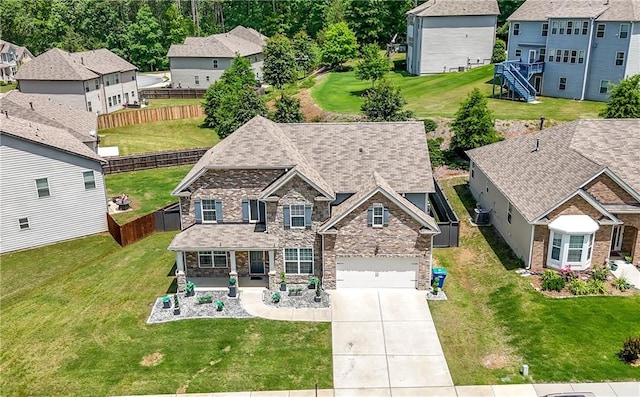view of front of home with driveway, a residential view, and a garage