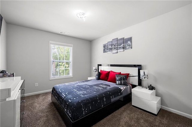 carpeted bedroom featuring baseboards