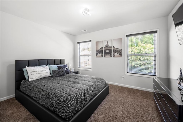bedroom with carpet and baseboards
