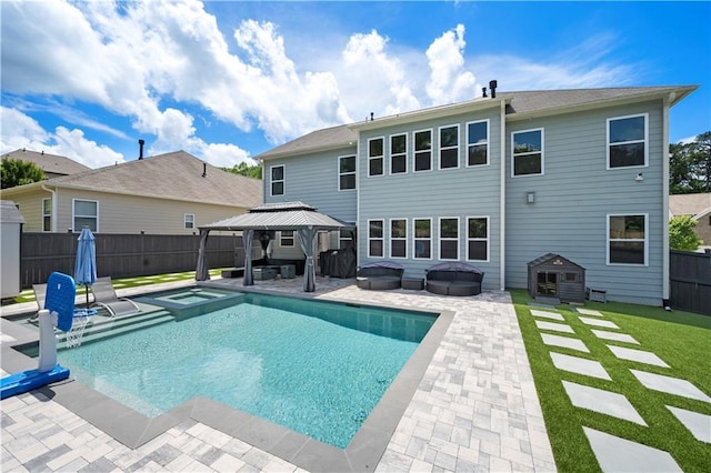 view of swimming pool with a gazebo, a patio, and a pool with connected hot tub