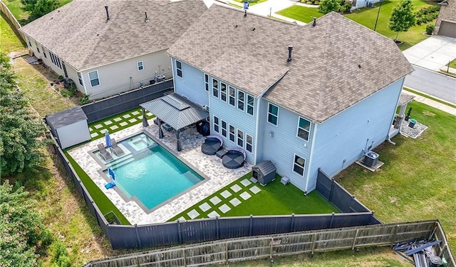 view from above of property with a pool area