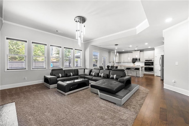 living room with crown molding, baseboards, recessed lighting, and dark wood-style floors