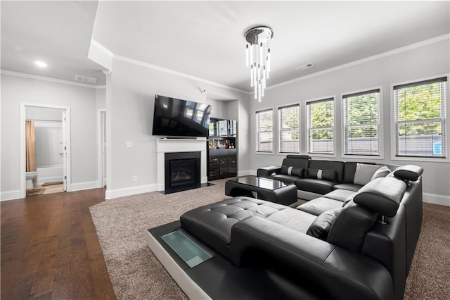 living room with crown molding, baseboards, a fireplace with flush hearth, and dark wood finished floors