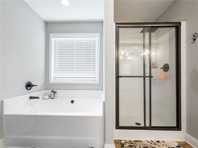 132 Mcmillian Ct, Winder, GA 30680 - full bathroom featuring a stall shower and a garden tub