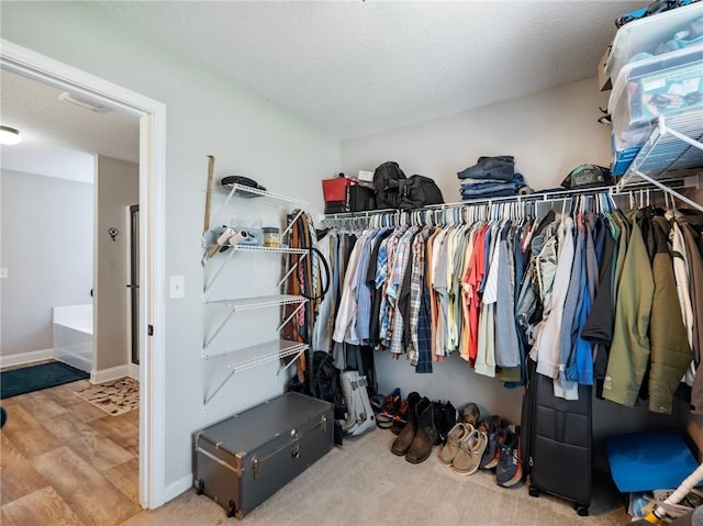 132 Mcmillian Ct, Winder, GA 30680 - spacious closet featuring wood finished floors