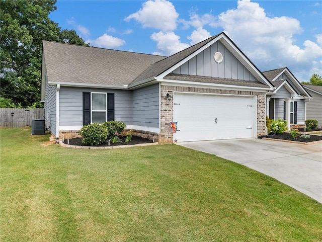 132 Mcmillian Ct, Winder, GA 30680 - view of front facade with brick siding, a garage, and central AC