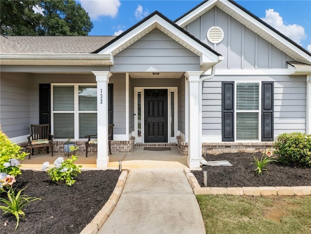132 Mcmillian Ct, Winder, GA 30680 - entrance to property with board and batten siding, covered porch, and a shingled roof