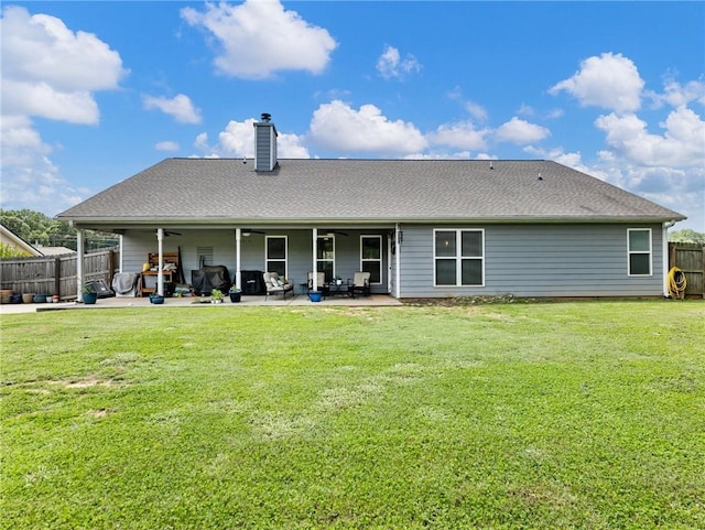 132 Mcmillian Ct, Winder, GA 30680 - back of property with a chimney, a patio area, and a ceiling fan