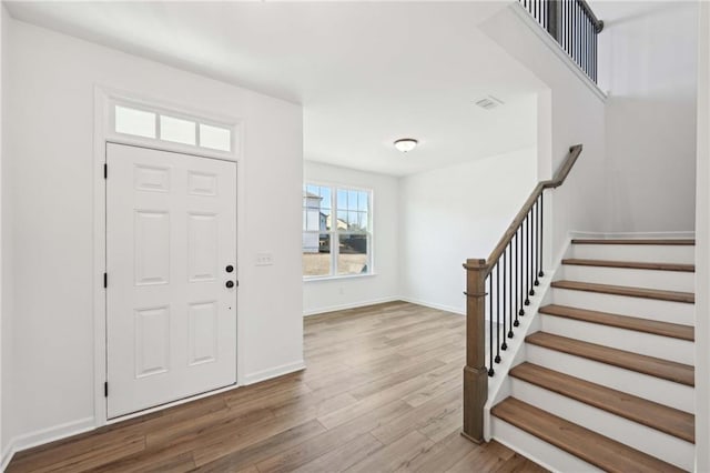 entryway with wood-type flooring