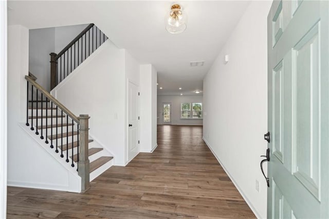 foyer with dark hardwood / wood-style flooring