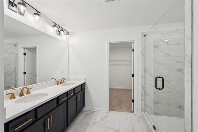 bathroom featuring vanity and a shower with shower door