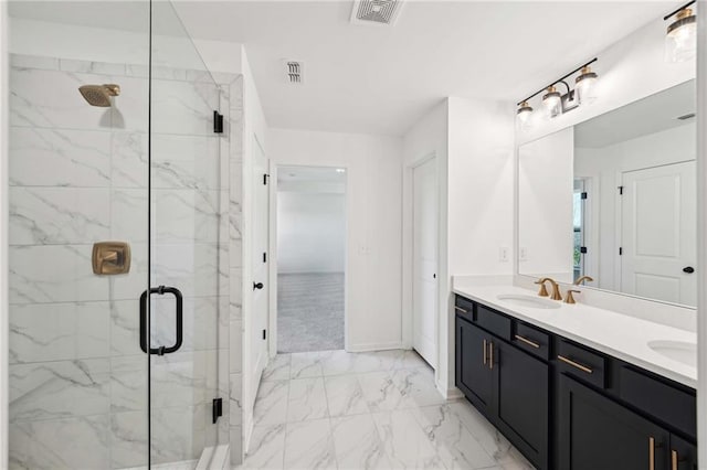 bathroom featuring vanity and a shower with shower door