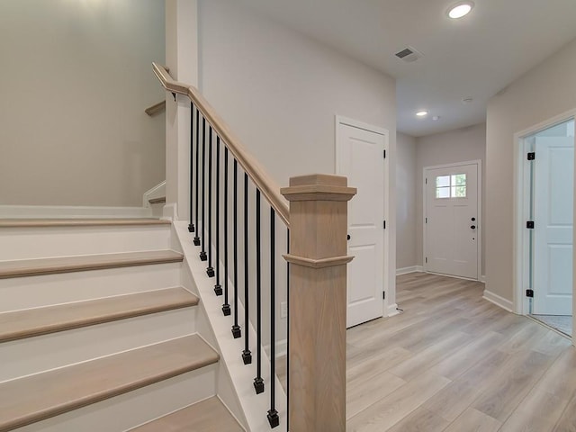 foyer with light hardwood / wood-style floors