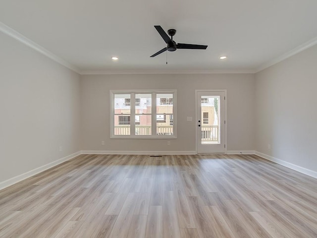 empty room with light hardwood / wood-style flooring, ceiling fan, and ornamental molding