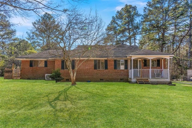 exterior space featuring a lawn and a porch