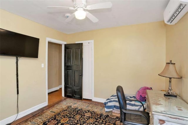 office featuring a wall mounted air conditioner and ceiling fan