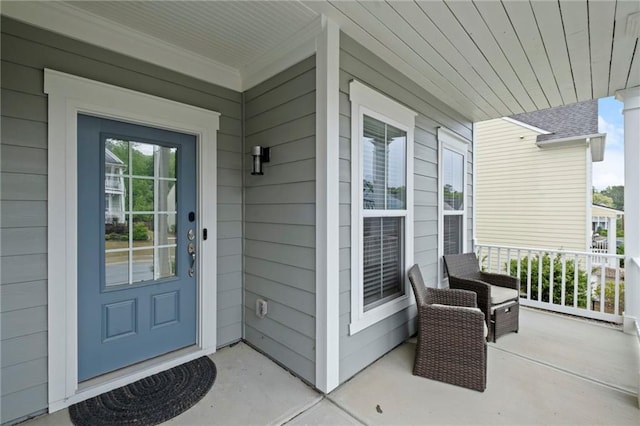 doorway to property featuring a porch