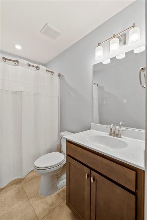 full bathroom featuring tile patterned floors, vanity, and toilet